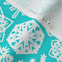 paper-cut snowflakes in aqua