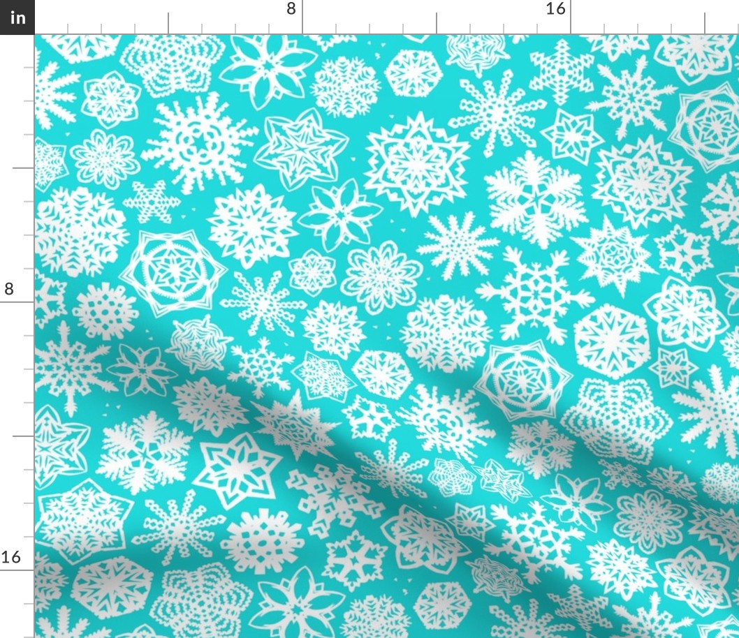 paper-cut snowflakes in aqua