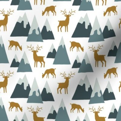 Alpine winter mountains with deer