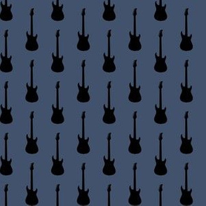 Black Electric Guitars on Blue Jeans Blue