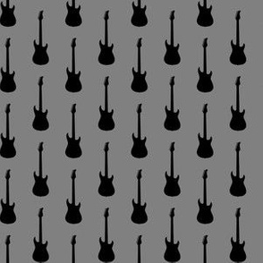 Black Electric Guitars on Medium Gray