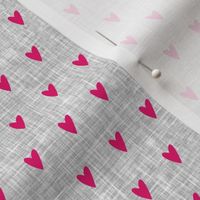 pink hearts on light grey linen