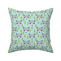 raccoons-sleeping-and-leaves-on-soft-blue