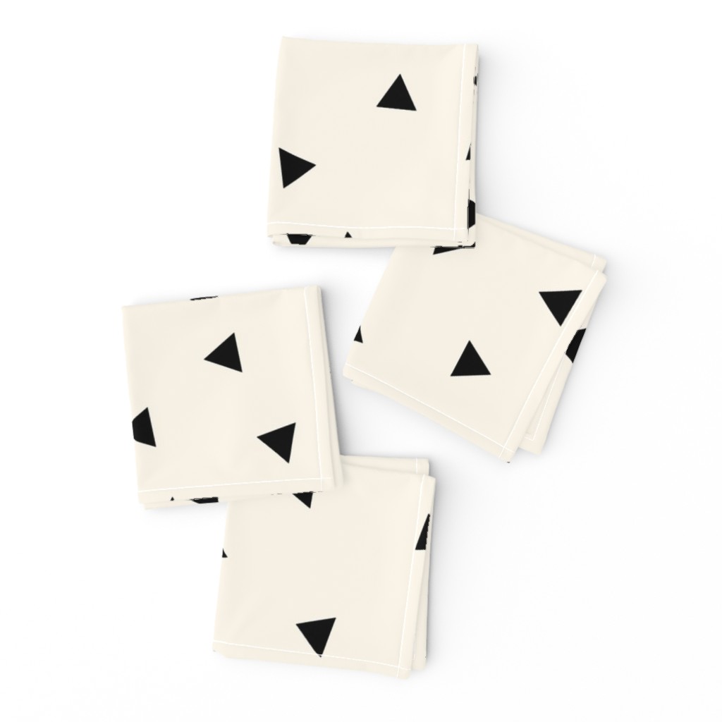 Black triangles (large) on ivory || scattered