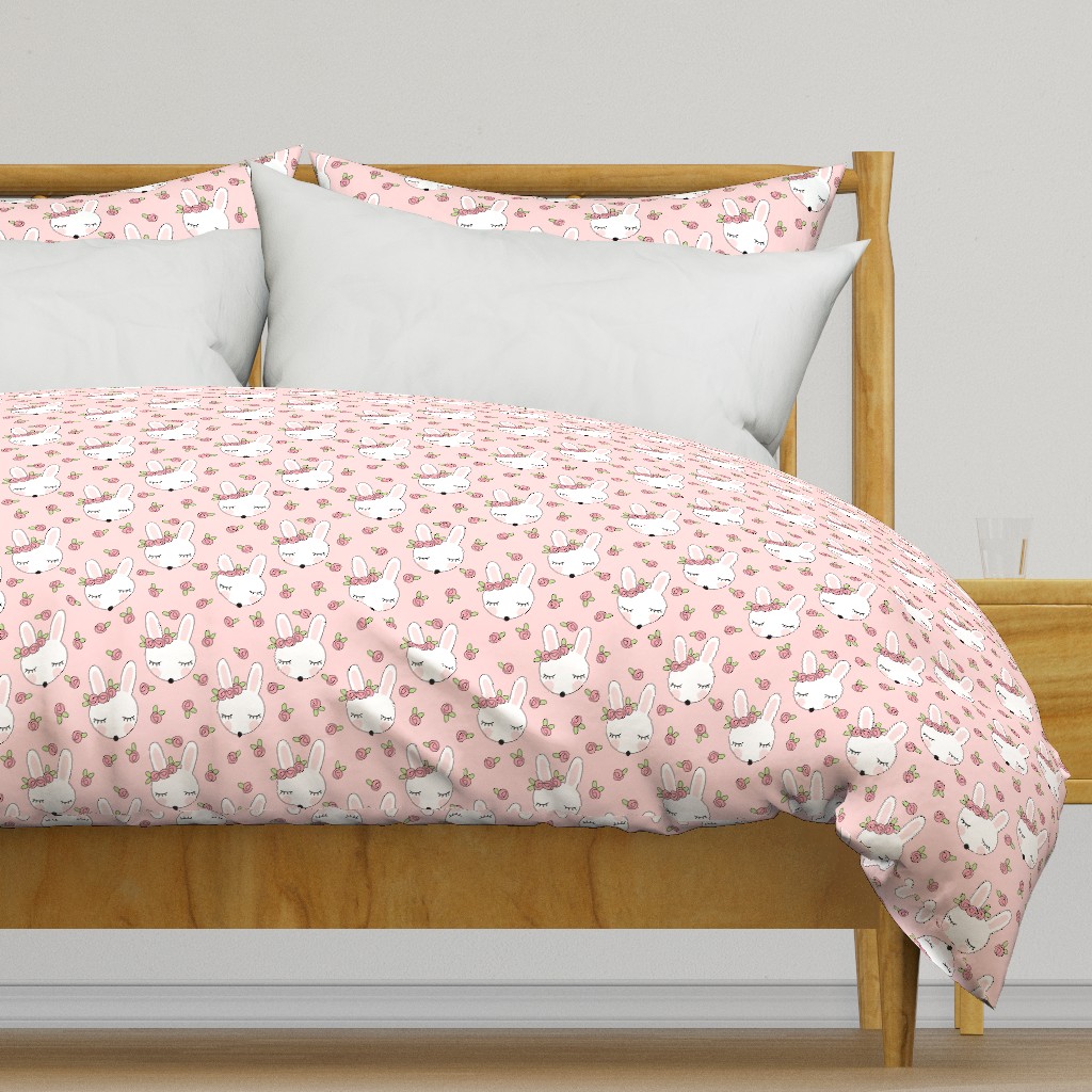 sleeping bunnies-with-pink-rosebuds on pink