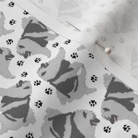 Tiny Trotting Keeshond and paw prints - white