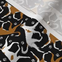 Tiny Trotting Ibizan hounds and paw prints - black