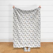 Trotting Papillons and paw prints - white