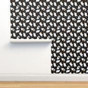 Trotting Papillons and paw prints - black