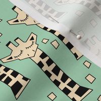 geometric giraffes on green