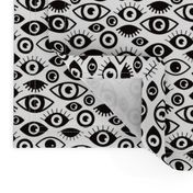 just eye balling and staring at you retro style eyes and eye lashes black and white