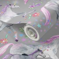 Mom and baby unicorns with pink and purple manes and tails on grey