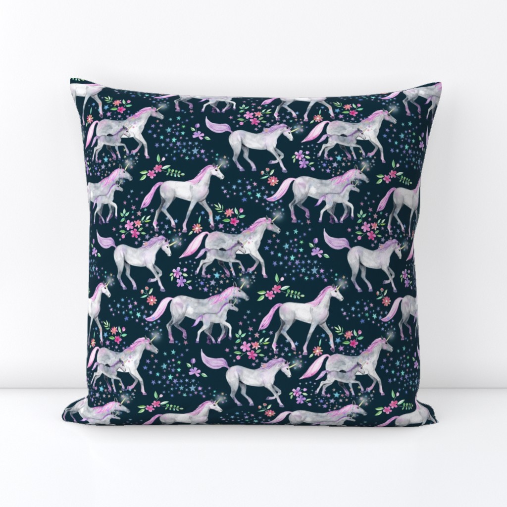 Mom and baby unicorns with pink and purple manes and tails on dark