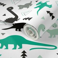 Adorable dino boys fabric with black and green dinosaur geometric triangles and funky animal illustration theme for kids