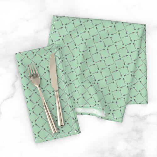 Forks on green background