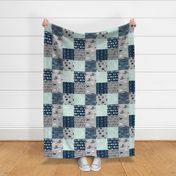 Wholecloth Patchwork Deer in navy, grey and mint. Rotated. Elk, arrows, woodgrain
