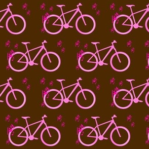 Pink bike and music on brown background