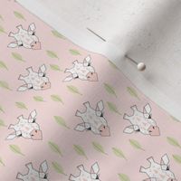 tiny giraffes-and-leaves-on-soft-pink