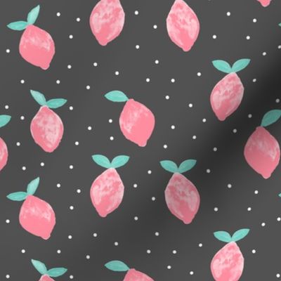 so fresh pink lemons on dark grey