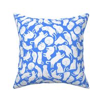 White_cats_on_blue_pattern
