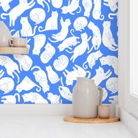 White_cats_on_blue_pattern