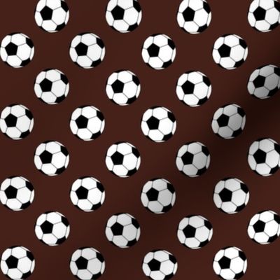 One Inch Black and White Soccer Balls on Brown