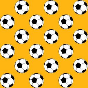 One Inch Black and White Soccer Balls on Yellow Gold