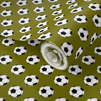 One Inch Black and White Soccer Balls on Olive Green