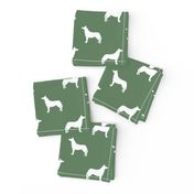 Husky dog silhouette med green