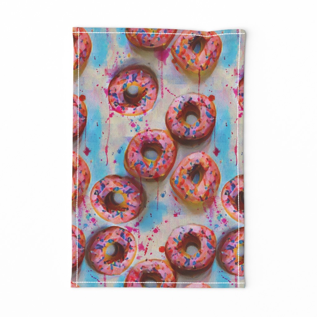 splattery painted pink donuts with sprinkles and blue shadows