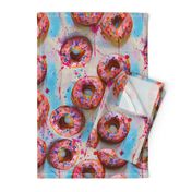 splattery painted pink donuts with sprinkles and blue shadows