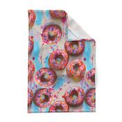 splattery painted pink donuts with sprinkles and blue shadows