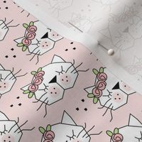 small kitty faces with rosebuds on pink