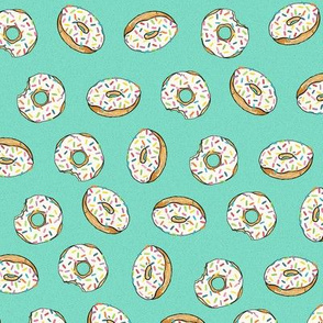 Glazed donuts with rainbow sprinkles on aqua