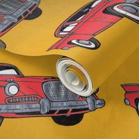 Big red finned 1957 Studebaker Hawk on gold background