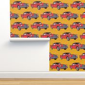 Big red finned 1957 Studebaker Hawk on gold background