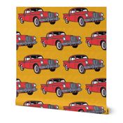 Big red finned 1957 Studebaker Hawk on gold background