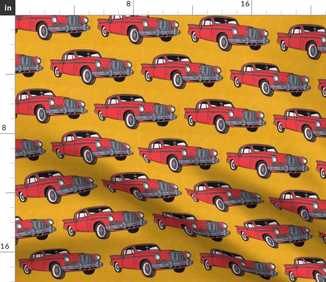 Big red finned 1957 Studebaker Hawk on gold background