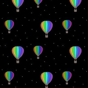 Rainbow hot air balloons at night