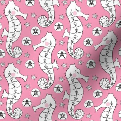 white seahorses on pink
