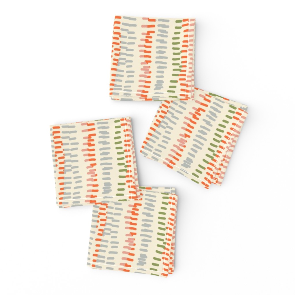 stitched rows in gray, green and orange on beige