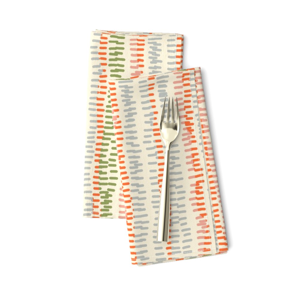 stitched rows in gray, green and orange on beige