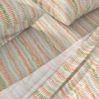 stitched rows in gray, green and orange on beige