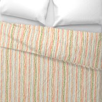 stitched rows in gray, green and orange on beige