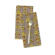 TIKI small YELLOW ON BEIGE HAWAII POLYNESIAN