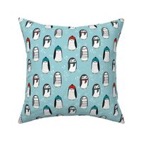 winter penguins // penguin in hats and scarves winter pingu holiday xmas fabric - lite blue