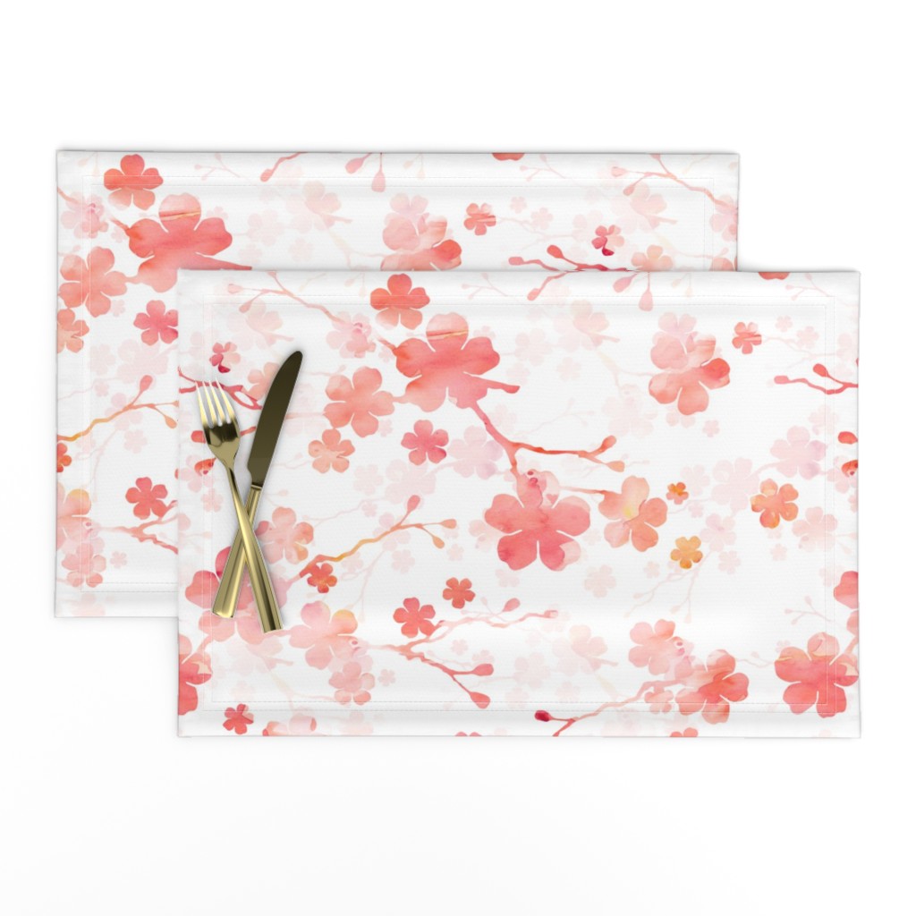 Peach pink cherry blossom on white