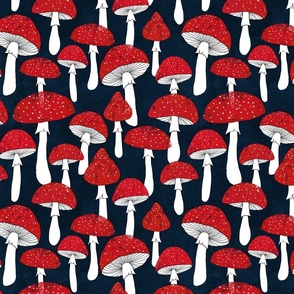 Red mushrooms on navy blue