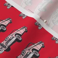 pink 1958 Edsel Citation convertible on red background