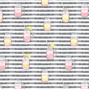 pink lemonade w/ straws - summer time drinks on grey stripes